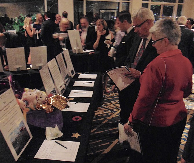 Guests check out the silent auction items during the Arc of Northern Virginia's Motown Experience Gala on Saturday, Oct. 22, 2016, at the McLean Hilton in Tysons Corner. 
