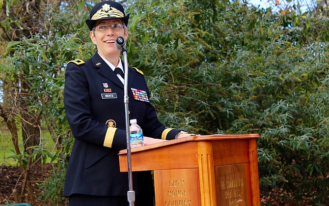 Maj. Gen. Julie Bentz, addressing the crowd, was commissioned as a 2nd Lt. in June 1986 and was promoted to her current rank in August 2013.
