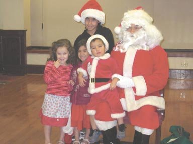 The Goyette family poses for a picture with Santa, bringing home a memorable Christmas photo.