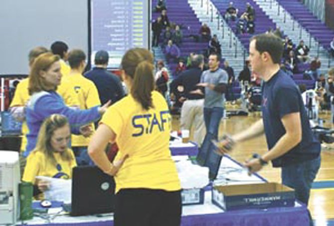 Volunteer staff members are seen working at the 26th Annual MidAtlantic Erg Sprints, which was held on Jan. 29, 2011 at the Gerry Bertier Gymnasium at T.C. Williams High School. 