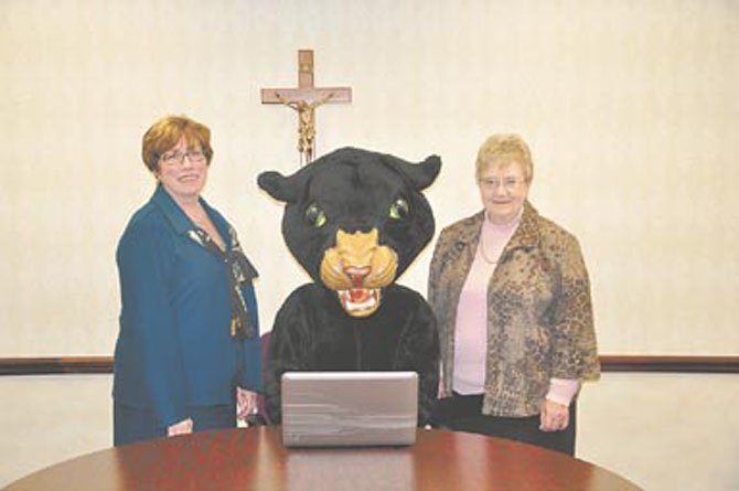 Signaling the launch of Paul VI’s new school-wide laptop program are (from left) Principal Ginny Colwell, the PVI panther mascot and Sister Bernadette McManigal, superintendent of Catholic Schools for the Arlington Diocese.