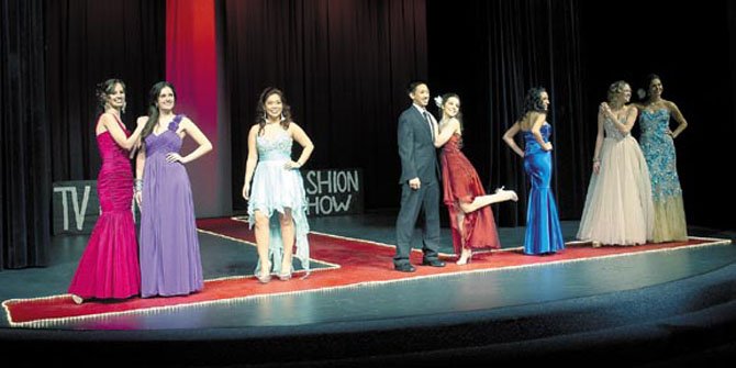 Robinson Secondary School students glam it up during the Jan. 11 DECA Fashion Show organized and run by students. Looks in the show were organized into scenes from popular television shows.  This final scene was from "The Bachelor." Pictured here (in no particular order): Jana Abutayeh, Hayley Aguayo, Mora Azez, Katie Jones, Charlie Nguyen, Rachel Thomas, Sarah Thompson.