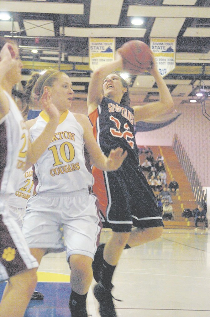 The Coyer twins, Caroline and Katherine, make up the best backcourt in the Northern Region. Pictured here is Katherine (10), who is averaging over 14 points per game this season.  