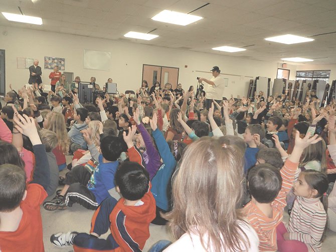 Nearly every student raised their hand when Paquin asked if they had seen "Dolphin Tale."