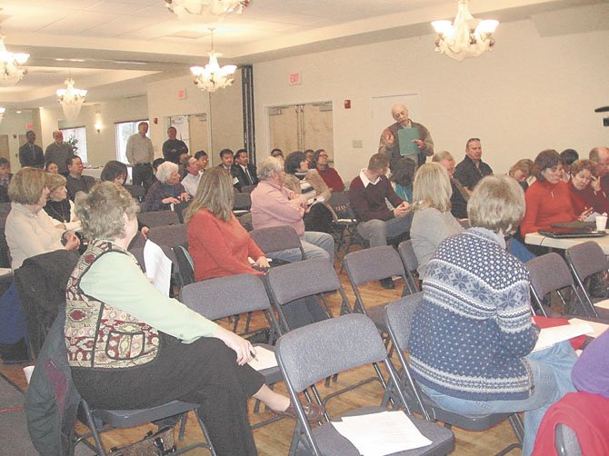 Local residents were invited to ask questions of speakers Chap Petersen and Mark Keam at the town hall meeting hosted by American Legion Post 180. 