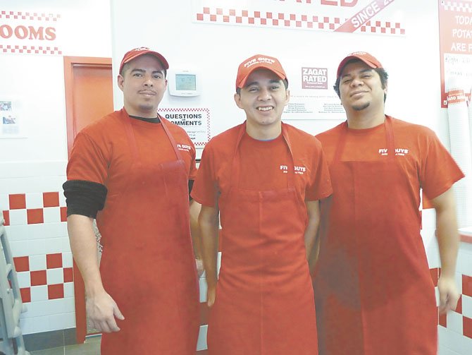 Christopher Sandoval, Pablo Escobar and Alex Guillen — some of the new staff at Five Guys.