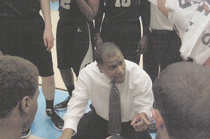 Westfield head coach Doug Ewell talks to his team during its game against Centreville.  