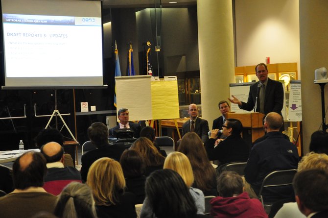 Geoffrey Morrison-Logan of Vanasse Hangen Brustlin, consultants hired by the Town of Herndon, speaks about possible Metro redevelopment at a public meeting Monday, Jan. 23. 