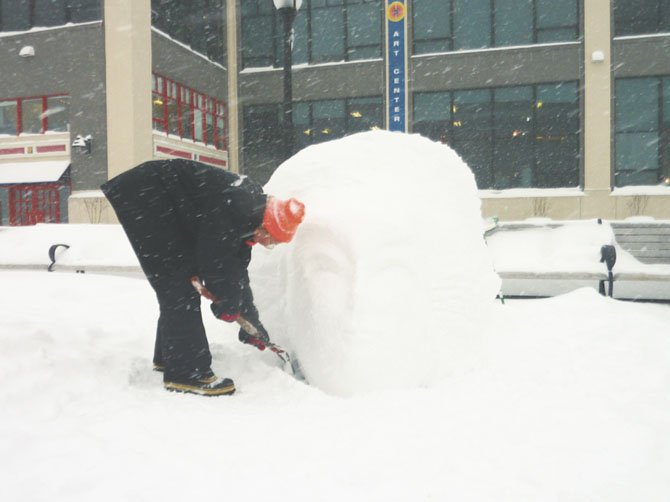 Torpedo Factory artist Tatyana Schremko takes advantage of one of last year's snow storms to make an ice sculpture.