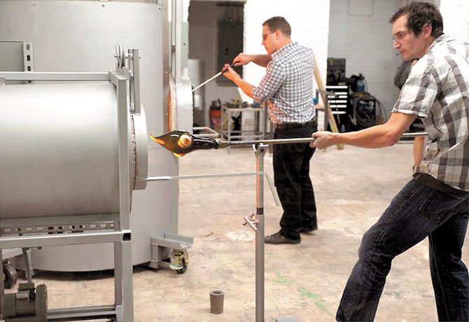 Students fire their glass-blown art in the new hot shop at the Lorton Workhouse Arts Center.