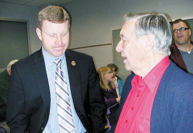 Supervisor Jeff McKay chats with constituent Sam McCutchen of the Greater Wilton Woods Civic Association during the Lee District Open House.