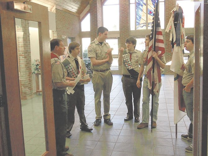 Nate Webber, Braeden Sebastian, and Gus Newton, with Scoutmaster Thomas Kiess and color guard before the Eagle Scout award ceremony.