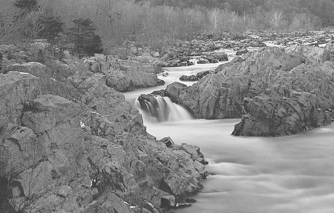 In the Moonlight: Taken on a cold December evening with the moon rising in the east this image was taken using a 30 second exposure. The depth of field is especially sharp as evidenced by the fine detail in the rocks and in the light-colored Sycamore trees along the Virginia shoreline. The long shutter speed of 30 seconds also provides a very smooth texture to the water. 