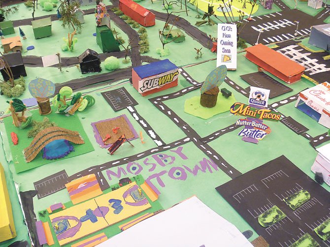 The fourth grade Advanced Academic Program (AAP) students at Mosby Woods Elementary created Mosby Town. There are shops, gas stations, single family homes, townhouses, retail stores, a hospital, sports arena, and a small airport.