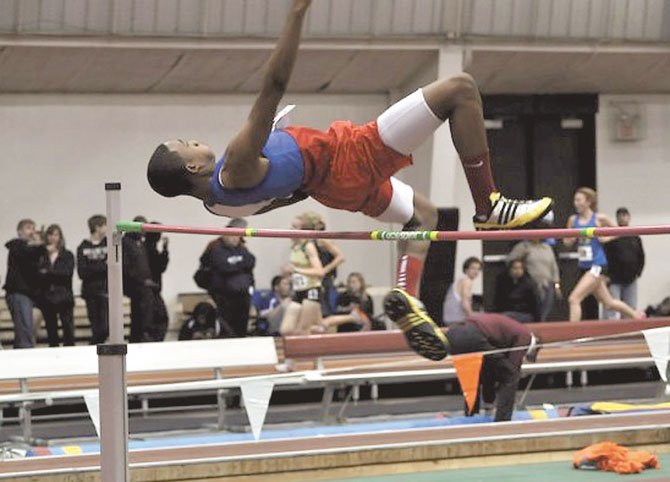T.C. Williams’ Kahron Lee clears 6 feet, 4 inches at the Virginia Tech High School Invitational last weekend.