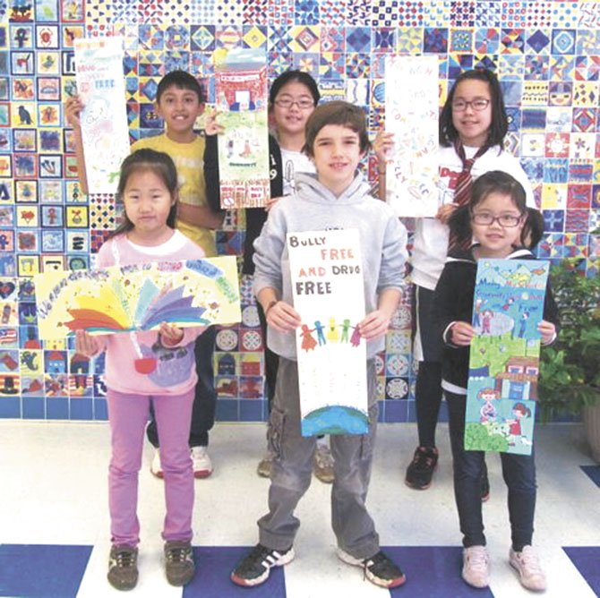 Pictured, from left, are the Churchill Road bookmark contest winners: (front row, K-3 category) Jae Rin Chung (3rd place); Sean Loftus (2nd place) and Elaine Li (first place); (back row, Grade 4-6 category) Linda Diaz (1st place), Jocelyn Liu (2nd place) and Alejandro Galdo (3rd place).
