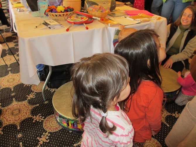 Youngsters pay attention at "Music Together" play station. "Music Together" has strong standing in the Vienna area. 