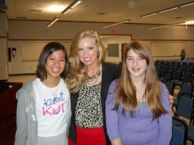 Seventh graders, Kim Schwadron, left, and Emily Swatt, right, were inspired by Miss Virginia’s message.