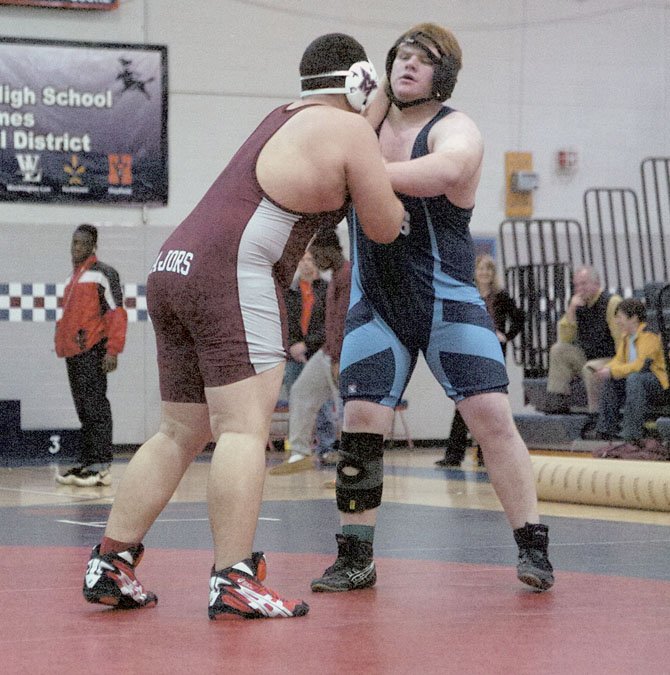 Yorktown’s Charlie Whelden, right, won the National District championship in the heavyweight division on Feb. 4 at Stuart High School.