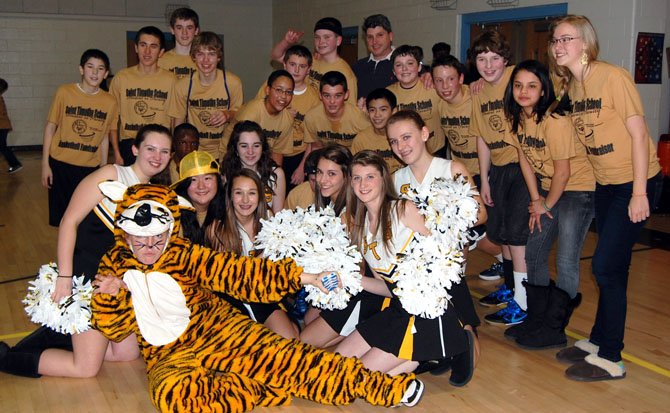 The winning team — the 8th grade students — at St. Timothy School’s Student vs. Faculty/Alumni basketball game.