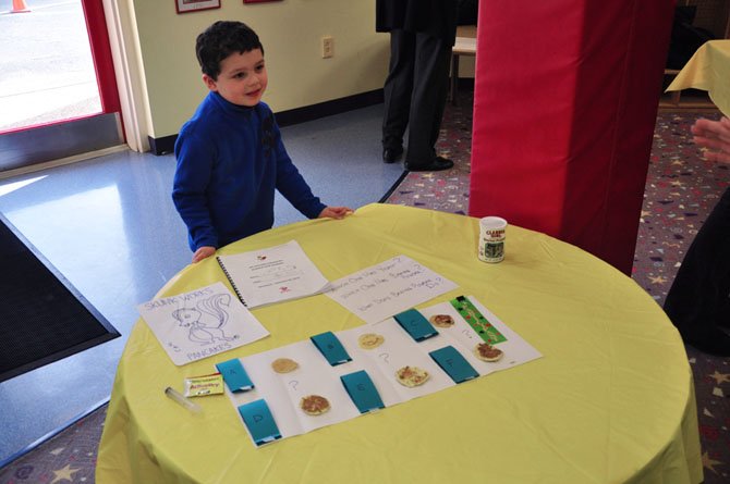 Cameron Cambetta presents his science fair project, pancakes made with and without a variety key ingredients at the Village Green Day School Friday, Feb. 10.