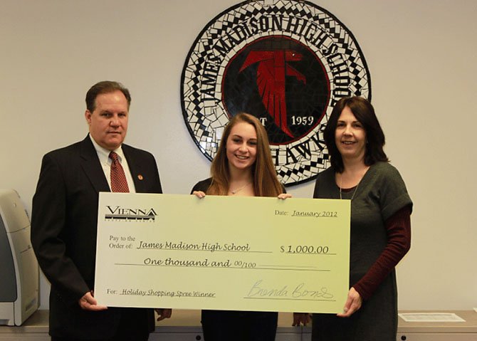 Pictured left to right: Mark Merrell, principal of James Madison High School; Maddie Hovis, winner of Vienna Shopping Center Shopping Spree; Brenda Bonds, marketing associate of The Rappaport Companies.

