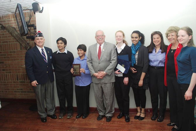 From left: Commander Gary Kelch of VFW Post 7327, third place Patriot's Pen winner Nithin Bagal, first place Patriot's Pen winner Paarth Jain, U.S. Rep. Gerry Connolly, second place Voice of Democracy winner Gwendolyn Cardiff, first place Voice of Democracy winner Hanan Awel, teacher of the year Sheila Bruen, Ladies Auxiliary President Linda Bond, and third place Voice of Democracy winner Megan Marriott.