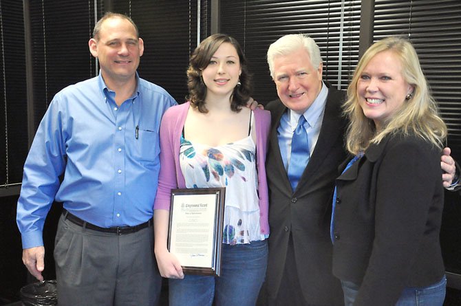 From left, John Marsh, his daughter Maureen, Rep. Jim Moran (D-8) and Carol Phelan-Marsh. Maureen, a junior at Langley High School, survived a rare form of bone cancer, and despite doctor’s predictions, she was able to recover from surgeries and chemotherapy to play volleyball again. Moran recognized the Marshes and the Langley community Monday, Feb. 13.