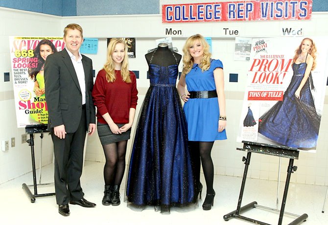 Samantha Bryant (middle) posed with the prom dress she’d created, along with Brian Beitler and Lis Rockey of David’s Bridal.  
 
