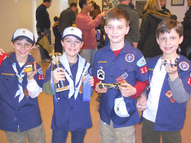 Third-grade Cub Scouts, Andrew Ruggeri, Will Denton, Grant Baker, and Logan Hanson, from Langley School after the race. Will Denton won first place for his den. 