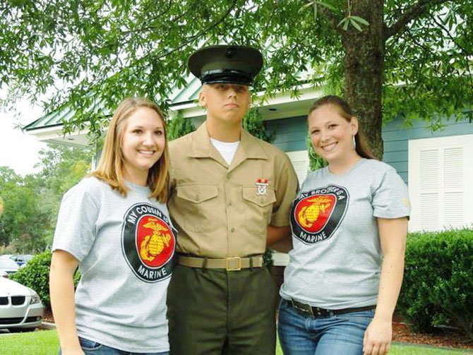 PFC Daniel Kellam on graduation day from boot camp on Parris Island, S. C. on Sept. 16. He is standing with his cousin, Heather Gillespie (left) and sister, Kristen Kellam (right).  