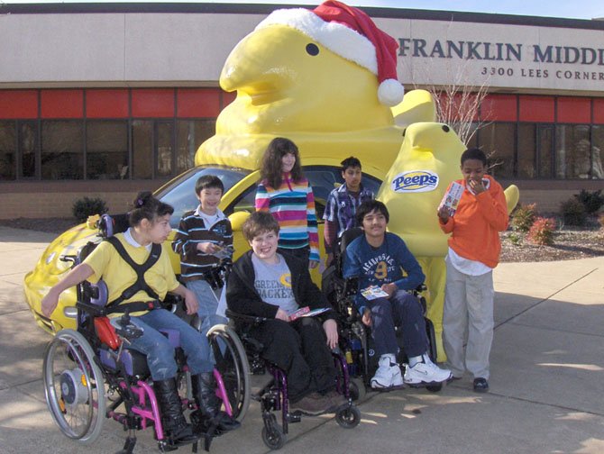 Posing with the Peeps Mobile are students in Franklin’s special-needs program. (Back row, from left) are Alex Nguyen, Lotti Wiltse and Adithya Mathuria, and (front row, from left) are Joeylin Caracoglia, Josh Cibula, Bharat Danturthy and Isaiah Thompson (standing). 