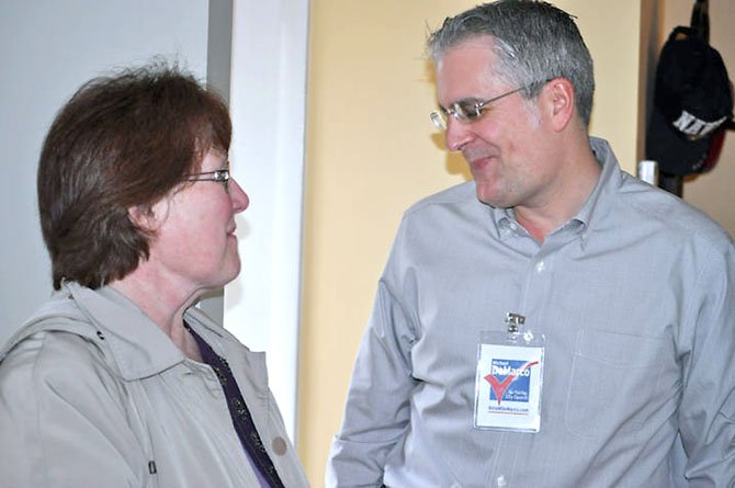 Michael DeMarco greets a guest at his open house on Sunday, Feb. 20. He is running for a Fairfax City Council seat.  