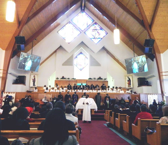 On Feb. 19, the sanctuary at Bethlehem Baptist Church was again filled with worshippers. In white (center) is the Rev. Dr. Darrell K. White. 