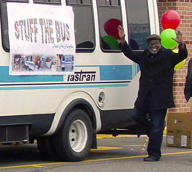 Michael Artson, chief planner with the County’s Neighborhood and Community Services (NCS) Department, shows his appreciation for the record amount of donations when the bus was parked at the McLean Giant.  

