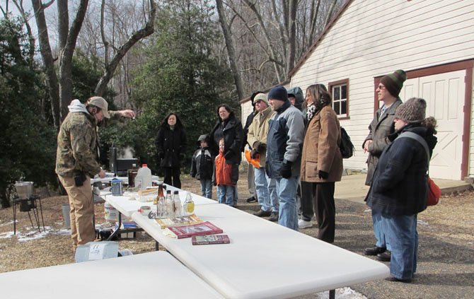 Guests bundled up for the cold to watch the maple syrup boil-down demonstration at Colvin Run Mill. 