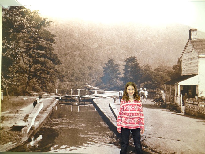 A student in front of the mural of one of the locks.