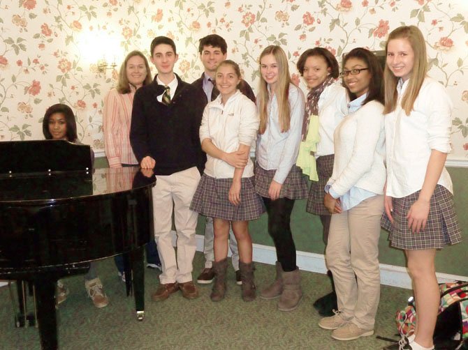 Gabby McIntosh, (at the piano) Dr. Sara Romeyn, Justin Schuble, Max Bramson, Jessica Mays, Allison Leasure, Chandler Bryant, Amala Nixon and Sarah Bair volunteer at Manor Care.