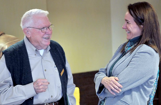 Goodwin House resident Jerry Denney talks with Carol Cadby, chair of the Theatre Arts Department at Yorktown High School
