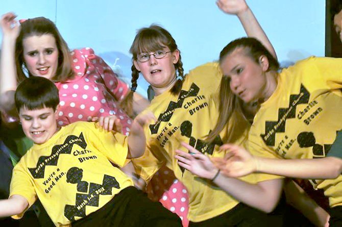 The Peanuts gang sticks together during dress rehearsals last week. From left, Sarah Miller, a freshman at Robinson Secondary School; Andrew Giddings, a seventh-grader at Irving Middle School; Katie Tisler, an eighth-grader at Lake Braddock Secondary School; and Taryn Falkenstein, a freshman at Robinson. 