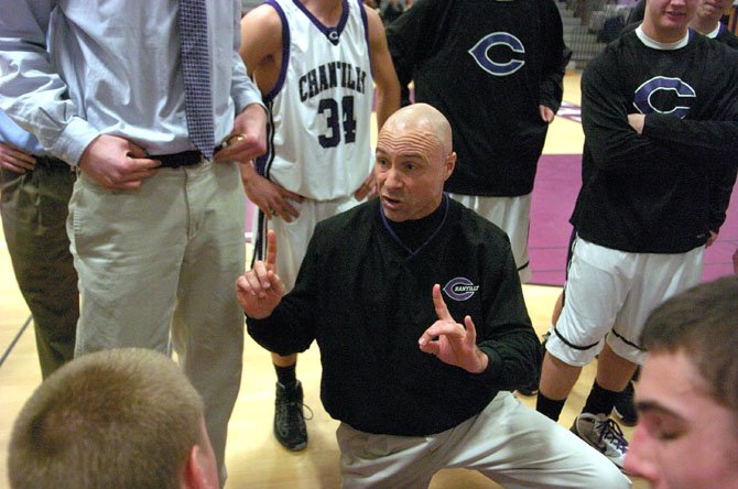 Jim Smith, shown here talking strategy with his Chargers, saw his team go 10-11 this season. The popular Smith has been at the helm of the Chantilly boys since 1991.  