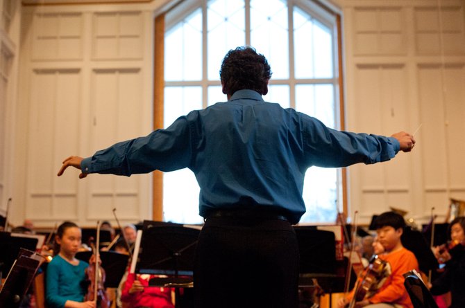 Fairfax Symphony Orchestra Music Director and Conductor Christopher Zimmerman conducts members of the American Youth Philharmonic Orchestras in a special side-by-side rehearsal with 28 members of the Fairfax Symphony Orchestra on Feb. 25 at the Vienna Presbyterian Church. 