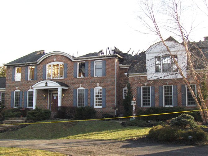 The aftermath: After Monday’s inferno, the roof of this nearly 4,800-square-foot home is gone and the second floor is decimated.
