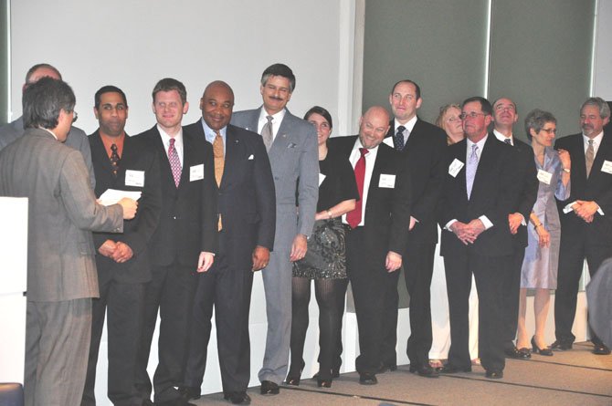 James S. Cheng, Virginia’s Secretary of Commerce and Trade swears in the 2012 board of directors for the Greater McLean Chamber of Commerce Friday March 2 at the Gannett Headquarters building. 