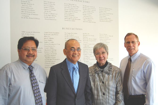 MCC Comptroller Bob Taguding, Roberto M. and Gloria M.T. Federigans and MCC Executive Director George Sachs in front of  the MCC Benefactors’ Wall.