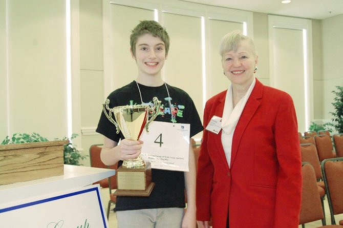 Spelling Bee champion Reid FitzHugh with bee sponsor Carolyn Meakem of The Meakem Group of Wells Fargo Advisors.