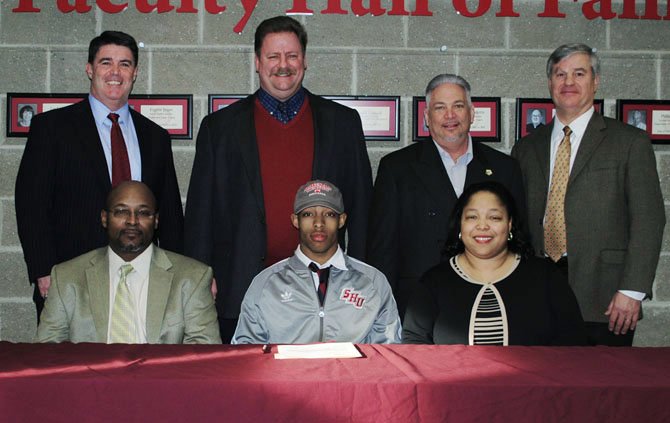 Moses Webb, bottom row, middle, was one of five Bishop Ireton seniors to sign national letters of intent to play college sports.
