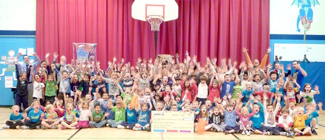 MCM Fun Run participants from George Mason Elementary School celebrate their Healthy School Award March 1. The school had 243 students participate in the run, which placed them in the top 5 and earned the PE department a check for $1,000.