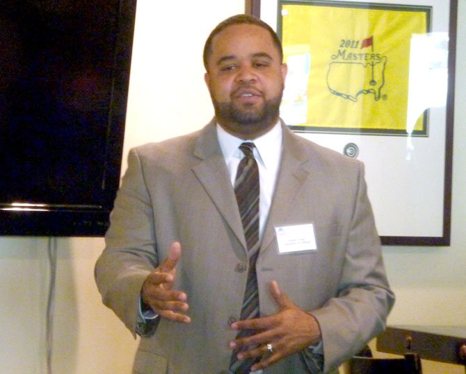 City Manager Rashad Young addresses the West End Business Association's Business Over Breakfast gathering March 7 at the Washington Suites Hotel.