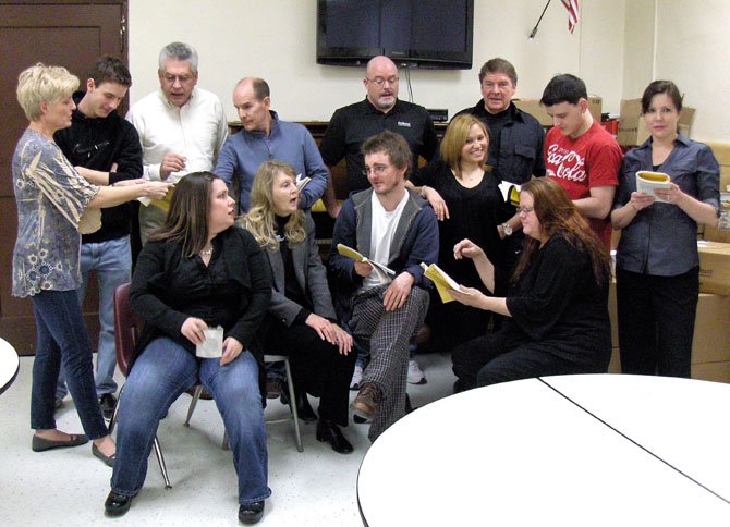 Members of The Alliance Theatre portray the cast of a summer-repertory company rehearsing for a show.